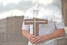 man holding a cross 
