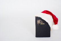 Santa hat and Holy Bible 
