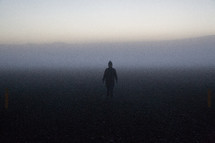 woman standing in fog in Iceland 