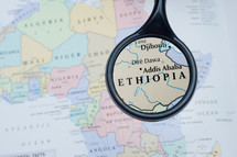 magnifying glass over a map of Ethiopia 