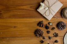 brown paper gift box and pines cones 