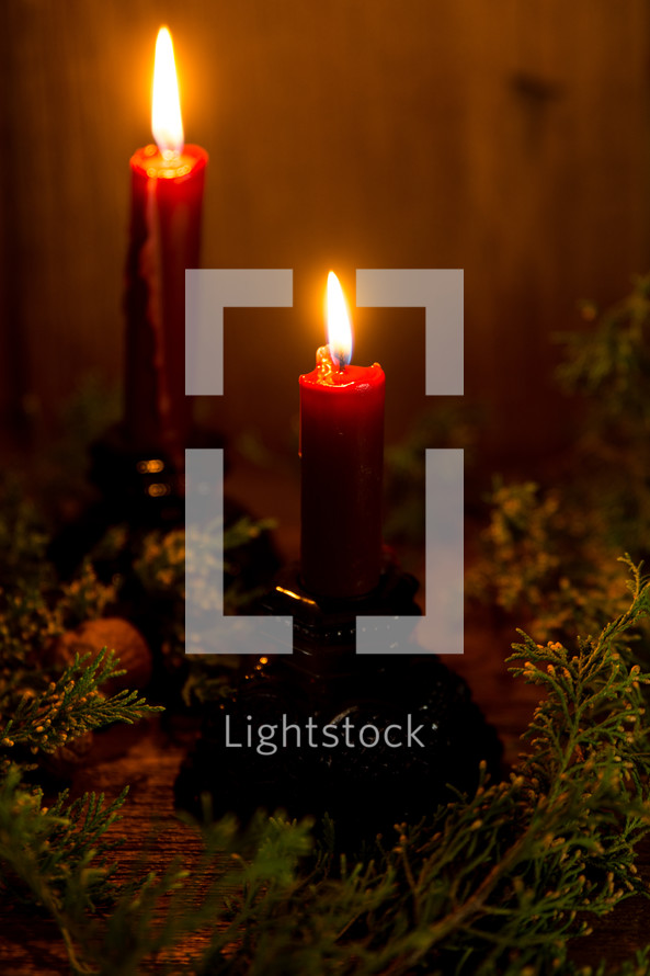 candle sticks with christmas greenery