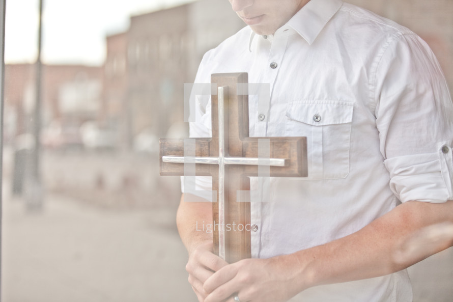 man holding a cross