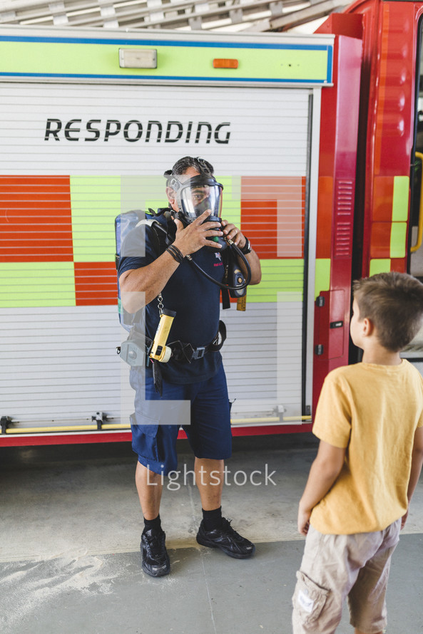 a child visiting a fire station 