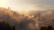The city of Jerusalem in the morning fog as the sun comes up. 