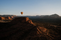 hot air balloon over a canyon 