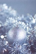 Close-up of silver christmas orb decoration.