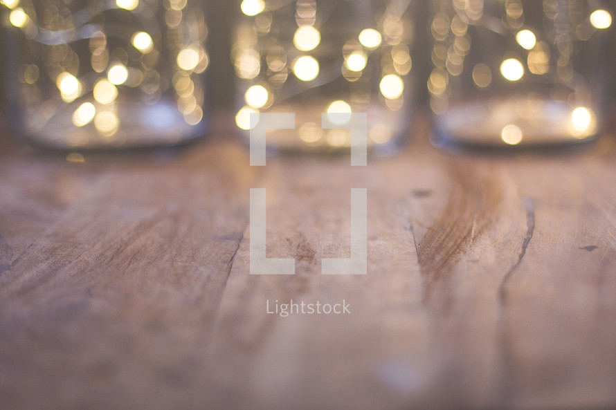 wood floor and bokeh lights from a Christmas tree 
