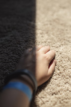 hand on carpet 