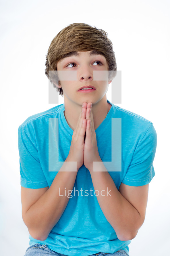 teen boy praying to God