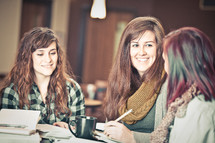 young women reading and discussing scripture at a Bible study