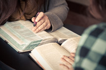 women reading from the Bible at a Bible study