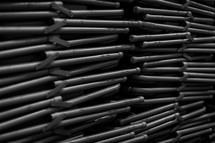 Closeup of a stack of folding chairs.