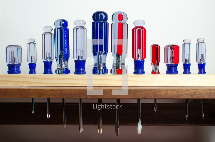 Screwdrivers on a workbench.