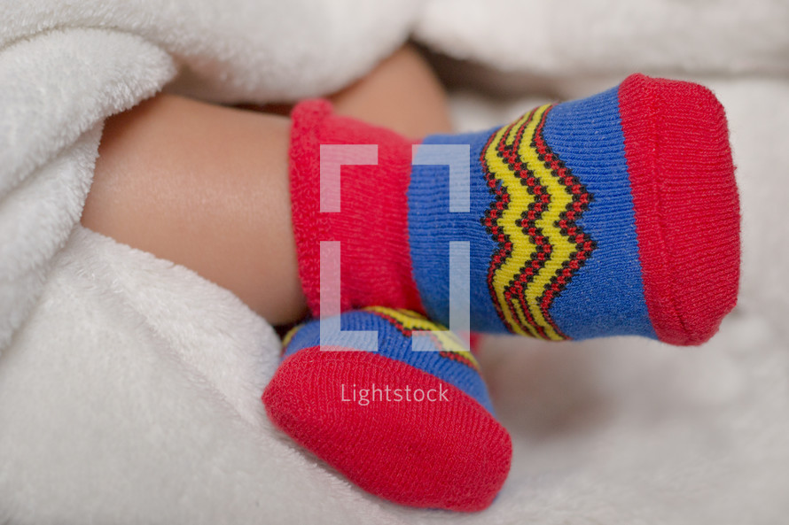 Wonder Woman socks on an infant 