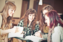young women discussing scripture at a Bible study