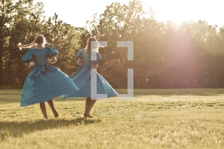 dancing girls in a field 