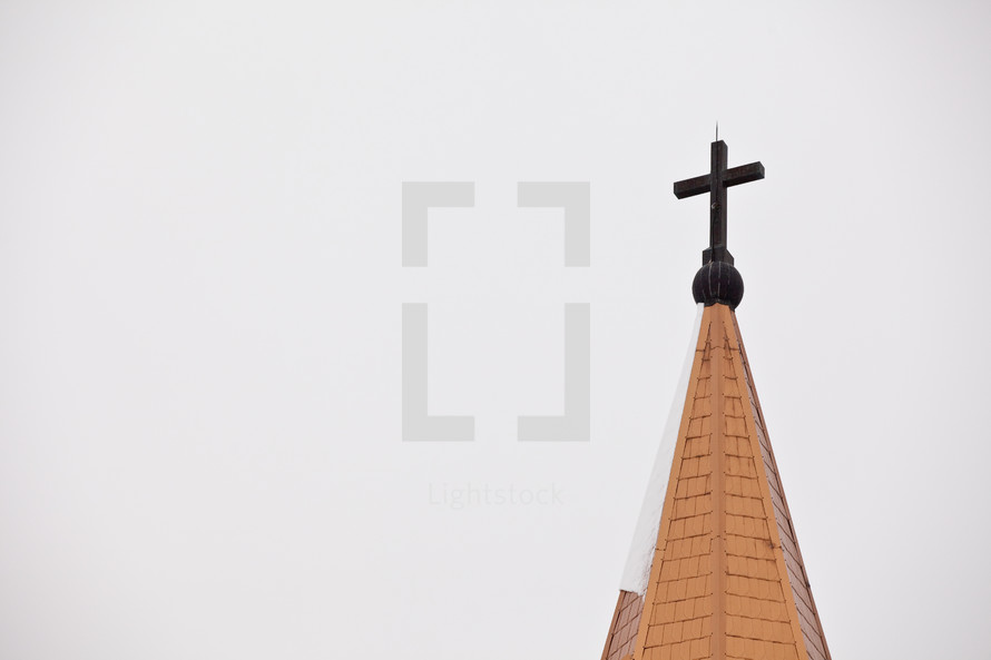 Church steeple with cross.