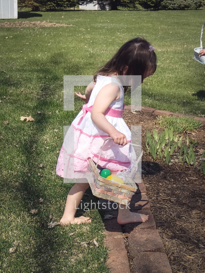 child holding an Easter basket 