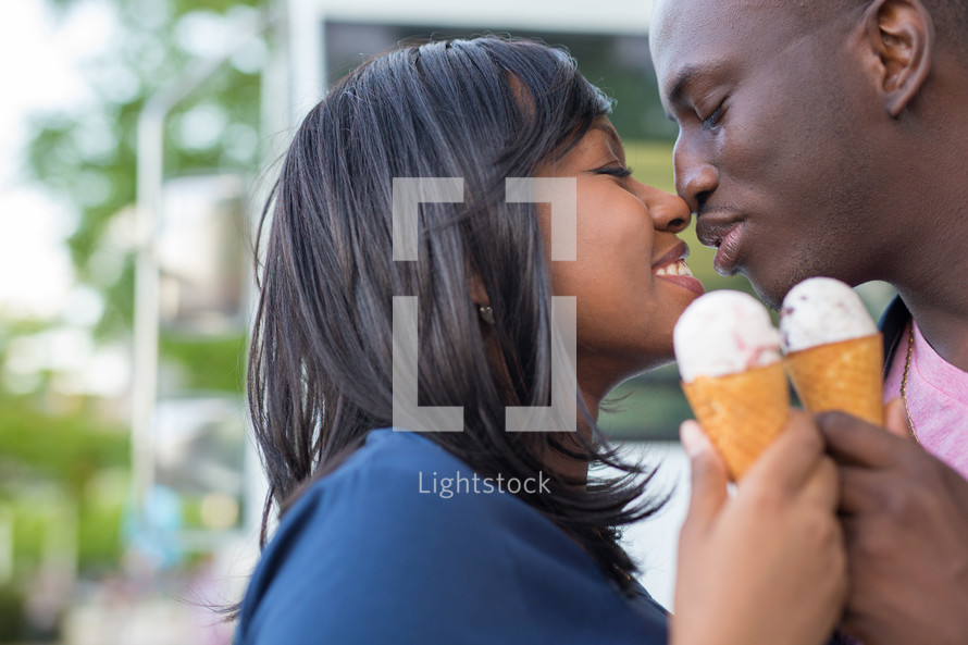 an African American couple eating ice cream 