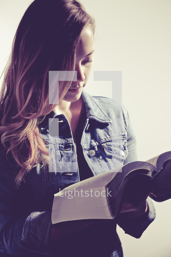 young woman reading a Bible