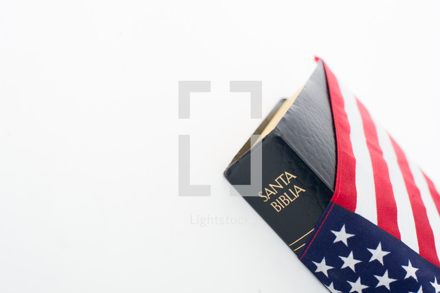 Spanish Holy Bible wrapped in an American flag.
