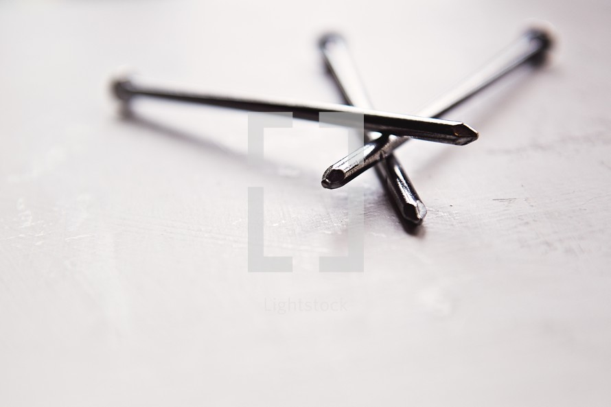 three nails on a white background 