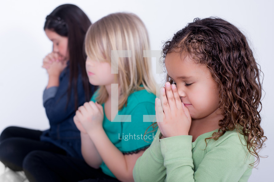 Girls praying.