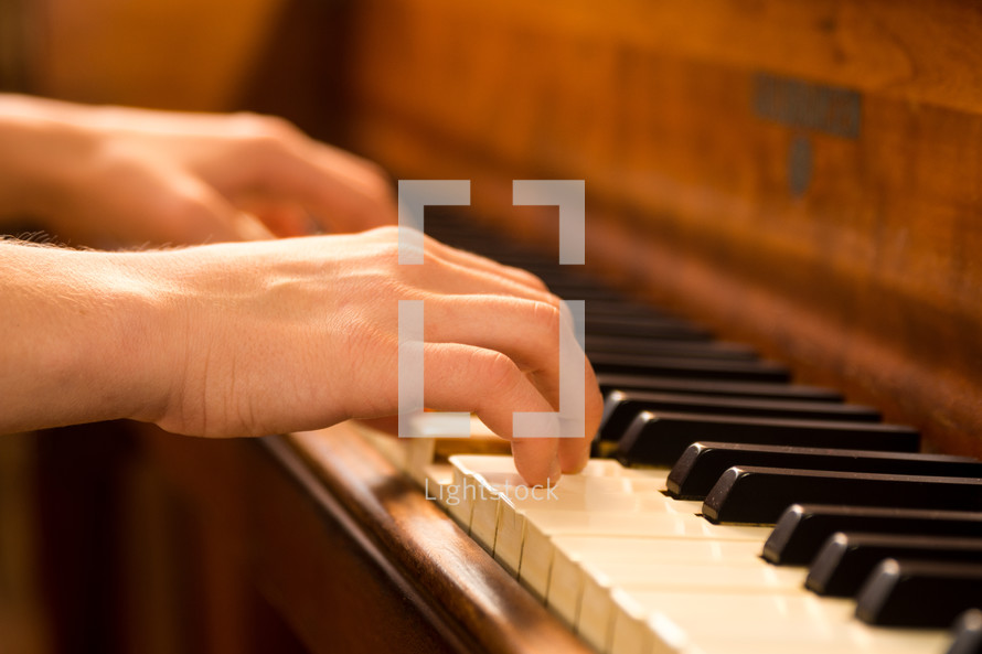 playing on a wood piano