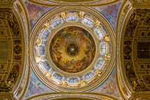 ornate paintings on the dome and celling in a cathedral 