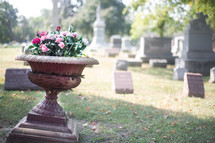 flowers in a planter in a cemetery - life and death 