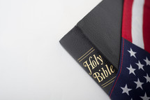 Bible draped with American flag