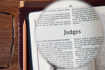 magnifying glass over Judges 