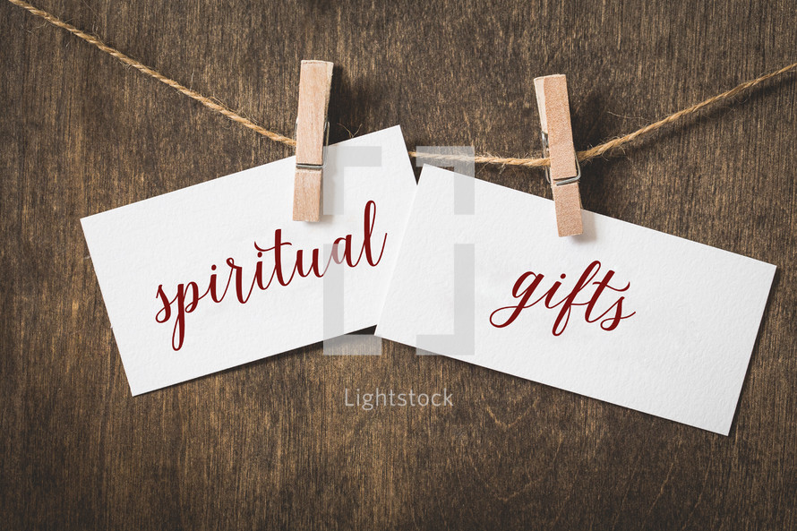 words spiritual gifts on card stock hanging on twine by a clothespin 