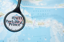 magnifying glass over a map of Haiti 