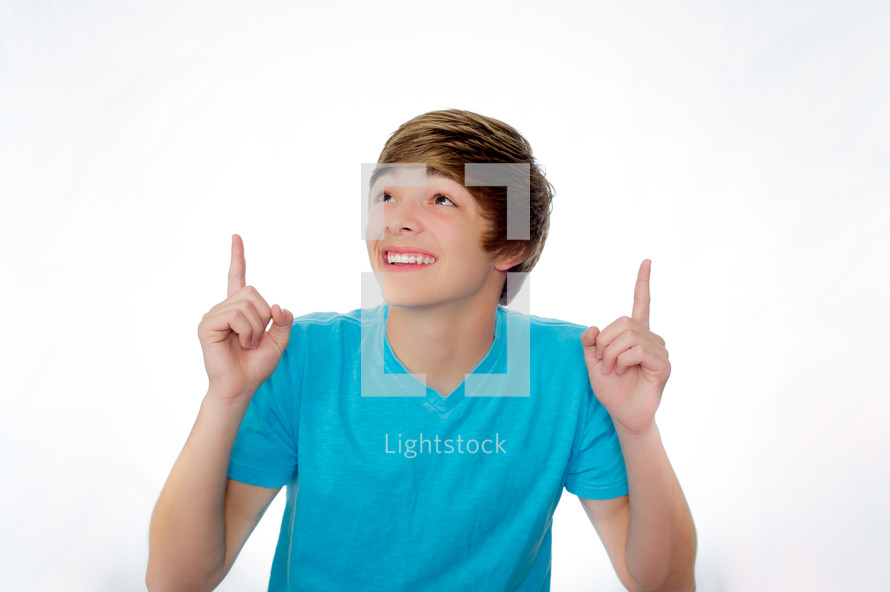 teen boy pointing up