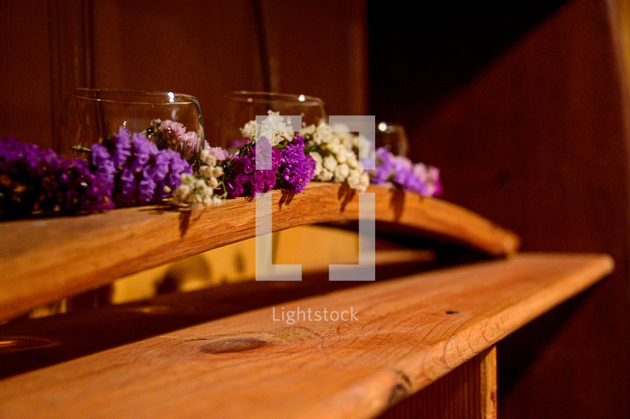 purple flowers on a shelf 