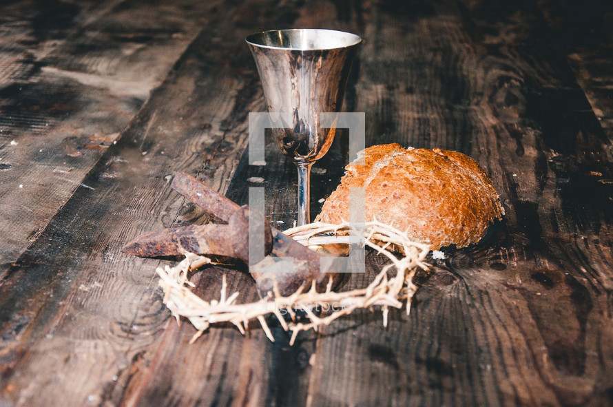 communion elements, crown of thorns, and three nails 
