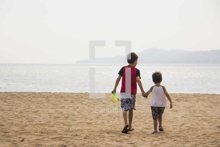 boys playing on a beach 