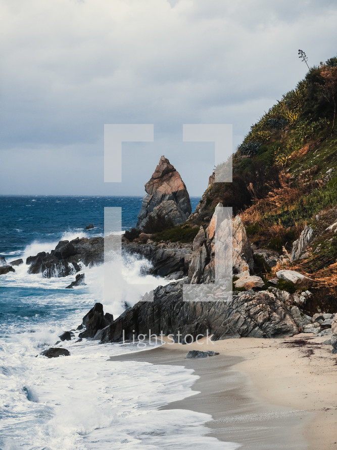 Waves of Stormy ocean crashing on rocks
