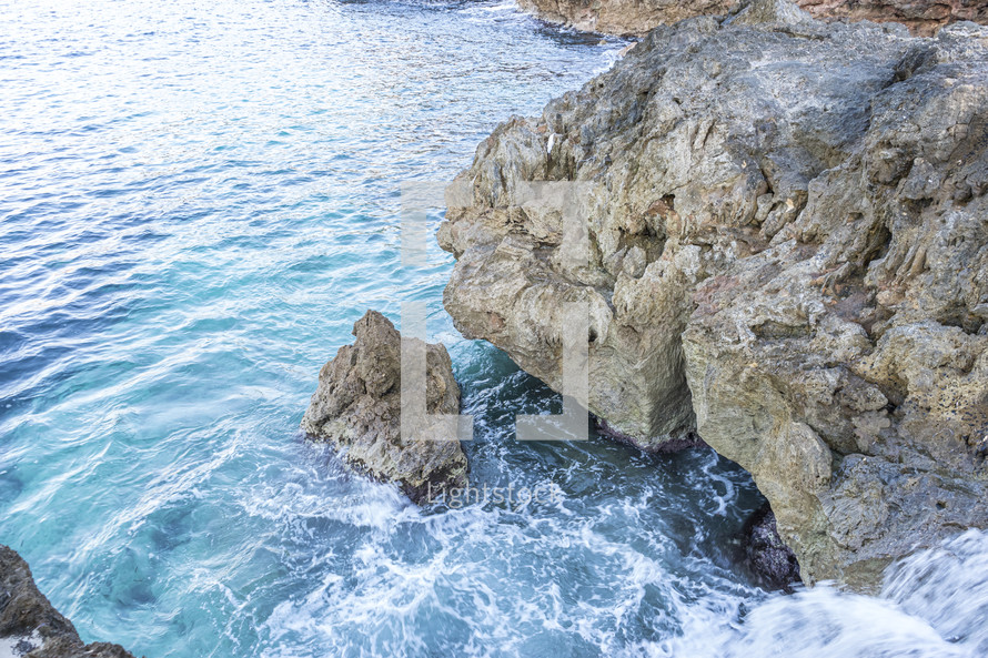 Mediterranean sea crashing against the rocks of the Spanish island of Mallorca, Ibiza, Spain