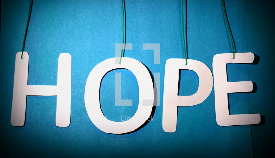 Letters spelling, "hope," hanging from string.