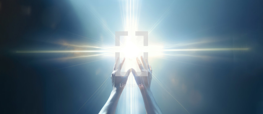 Hands raised towards luminous cross 
