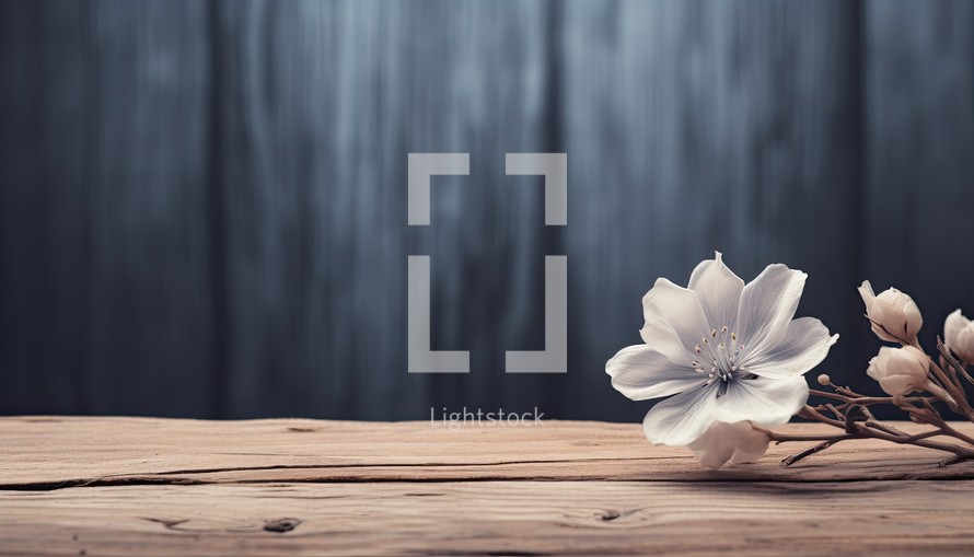 Wooden table with spring flowers on dark wooden background. Toned.