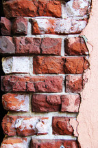 Stucco on a brick wall.