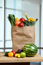 produce in a paper grocery bag 