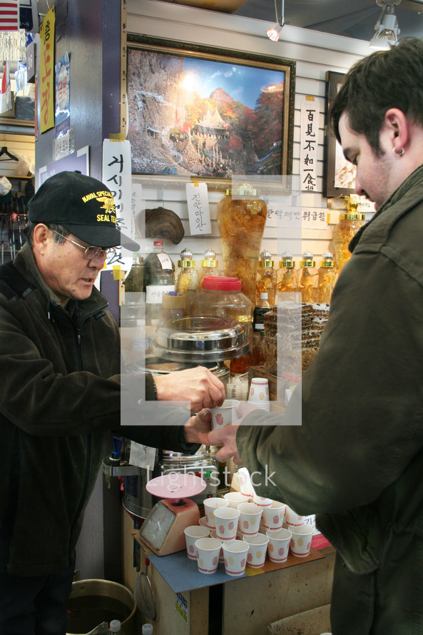 man buying tea in Korea 