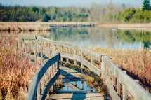 Wooden bridge across a lake.