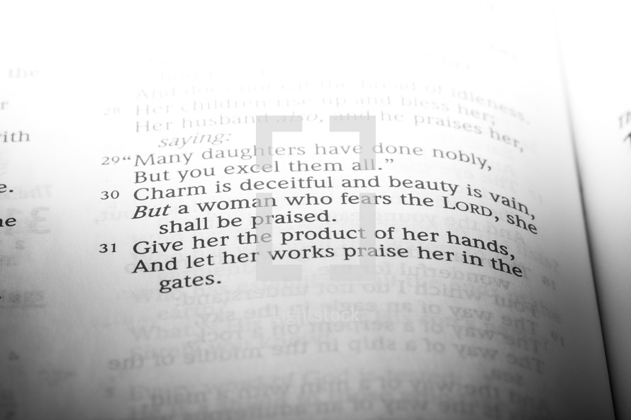 Bible open to Proverbs 31:29-31.