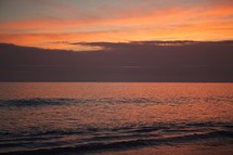 Rolling ocean tide at dusk.